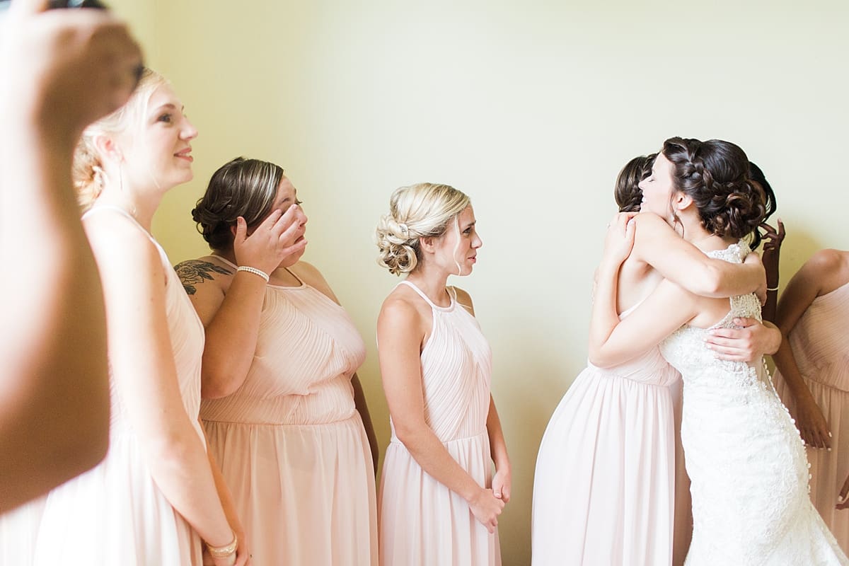 Arielle Peters Photography | Bride and bridesmaids having first reveal on wedding day at Newlife Community Church in Chicago, Illinois.