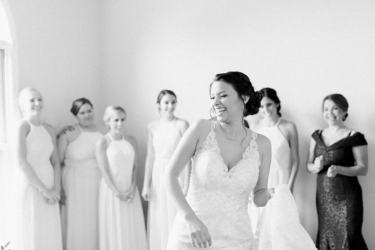 Arielle Peters Photography | Bride and bridesmaids having first reveal on wedding day at Newlife Community Church in Chicago, Illinois.