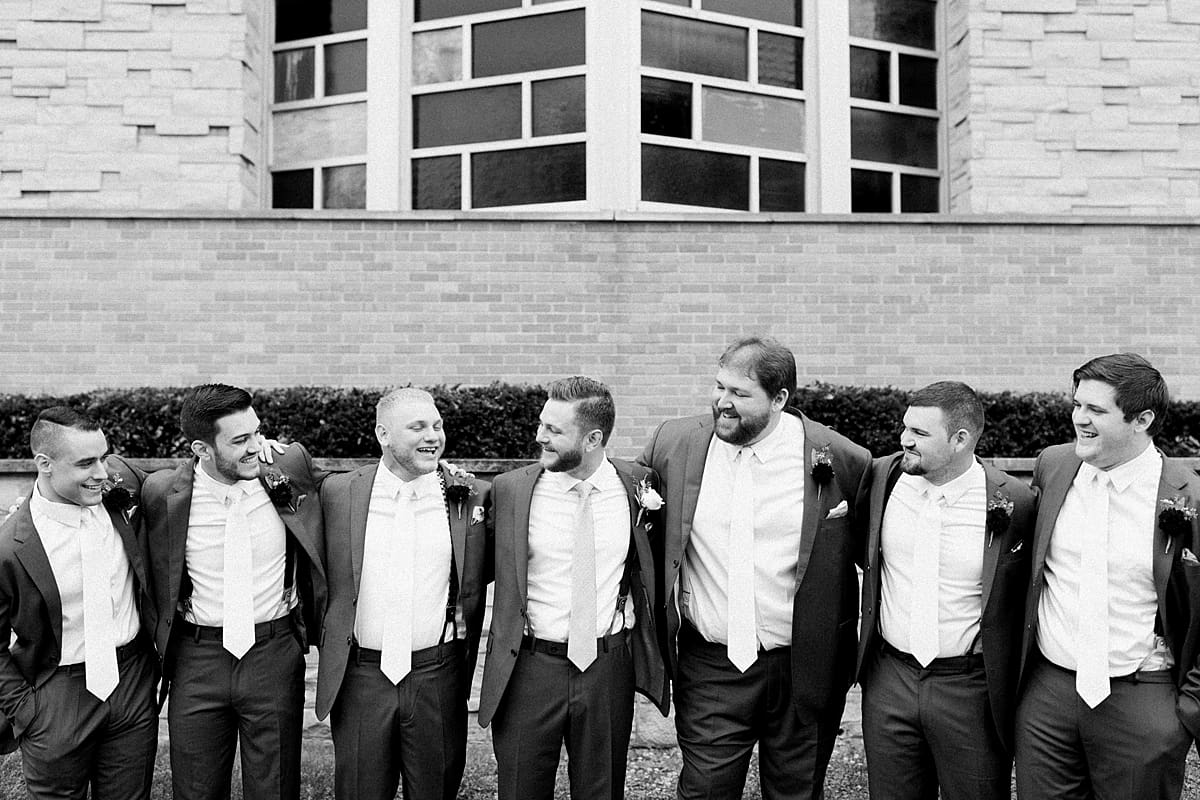 Arielle Peters Photography | Groom and groomsmen in tuxes on wedding day at Newlife Community Church in Chicago, Illinois.