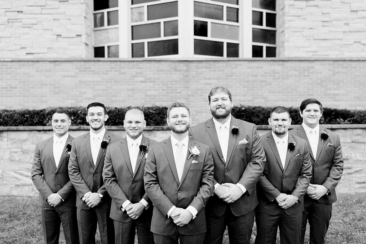 Arielle Peters Photography | Groom and groomsmen in tuxes on wedding day at Newlife Community Church in Chicago, Illinois.