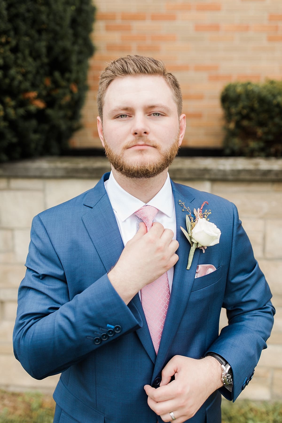 Arielle Peters Photography | Groom adjusting his tie on wedding day at Newlife Community Church in Chicago, Illinois.