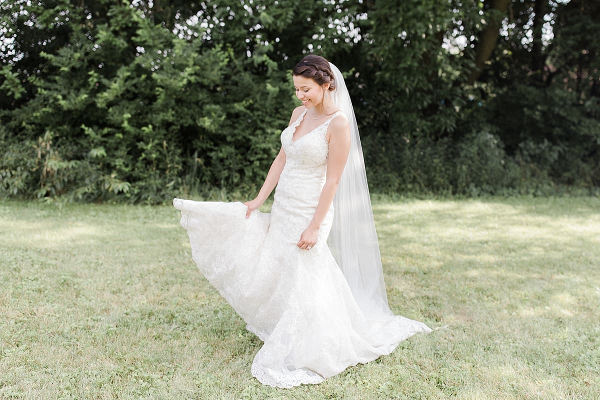 Arielle Peters Photography | Bride spinning in wedding dress outside on wedding day at Newlife Community Church in Chicago, Illinois.