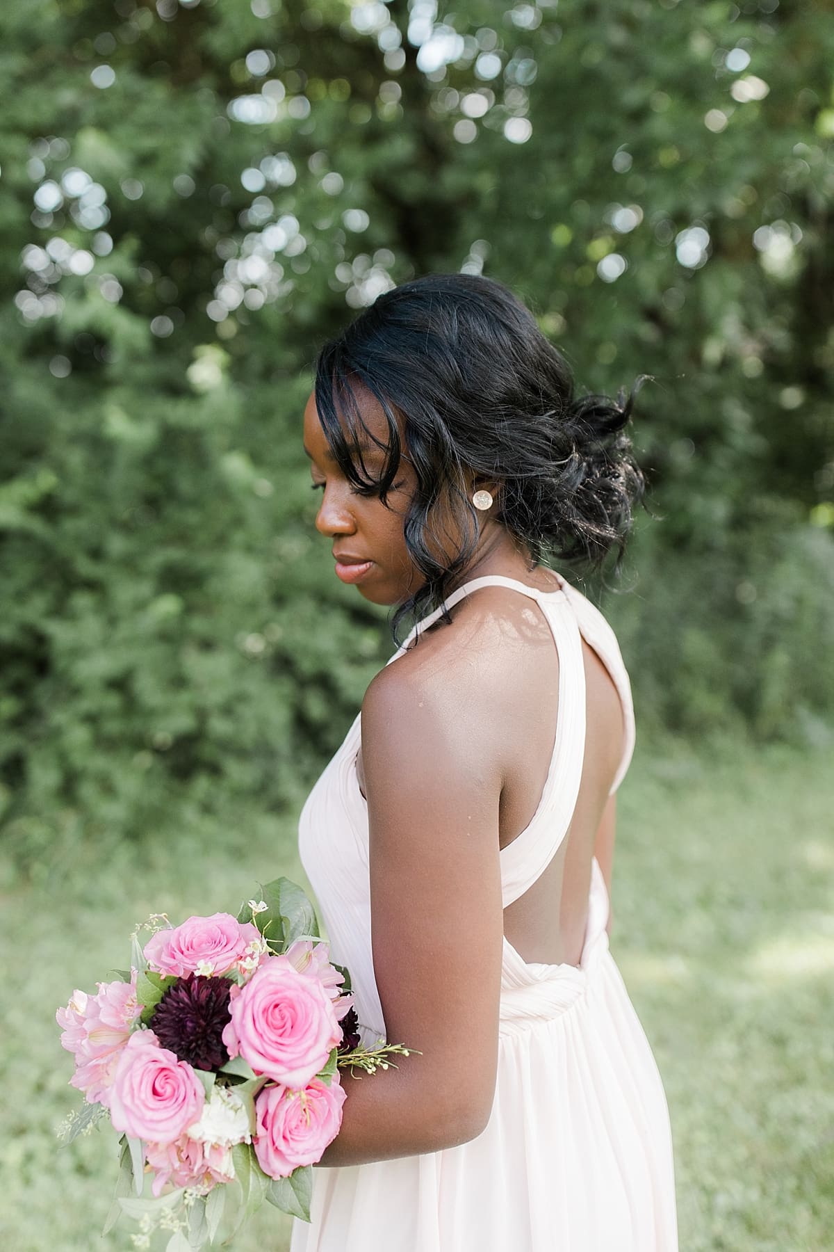 Arielle Peters Photography | Bridesmaids holding bouquet outside on wedding day at Newlife Community Church in Chicago, Illinois.