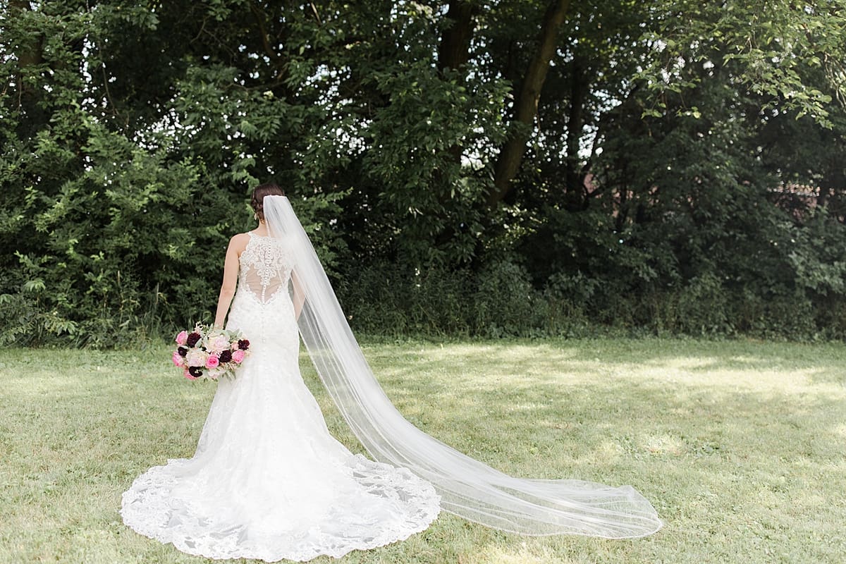 Arielle Peters Photography | Bride in her gown and veil outside on wedding day at Newlife Community Church in Chicago, Illinois.