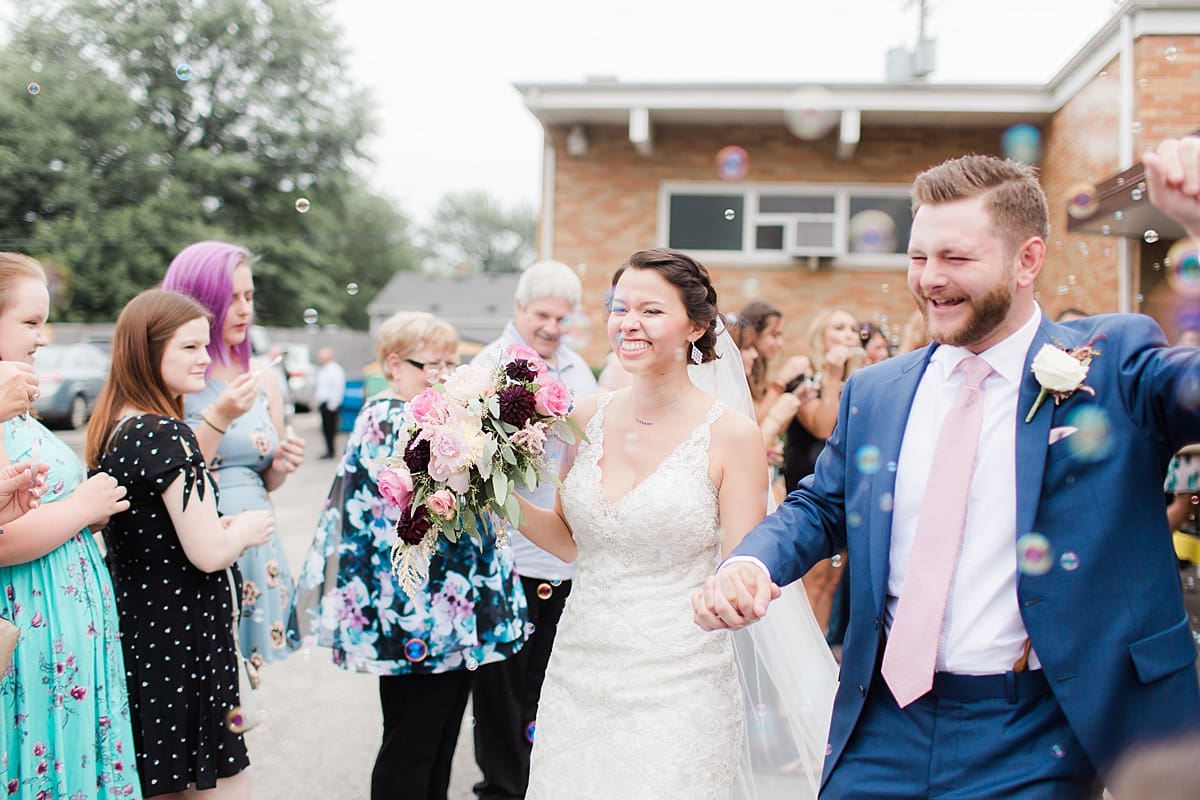 Arielle Peters Photography | Bride and groom leaving church on wedding day at Newlife Community Church in Chicago, Illinois.
