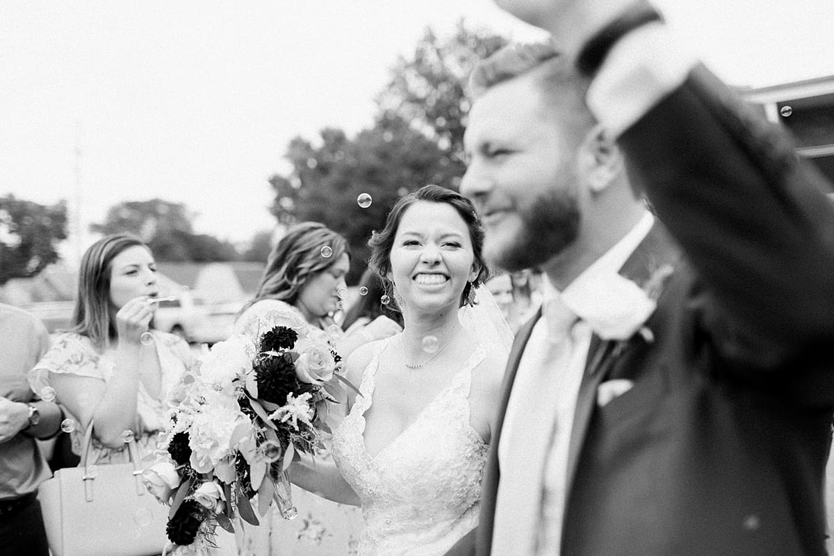 Arielle Peters Photography | Bride and groom leaving church on wedding day at Newlife Community Church in Chicago, Illinois.