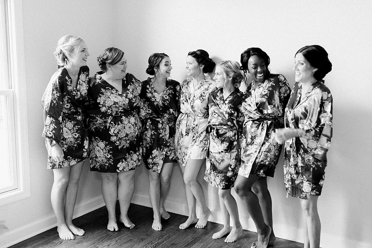 Arielle Peters Photography | Bride and bridesmaids in robes getting ready on wedding day at Newlife Community Church in Chicago, Illinois.