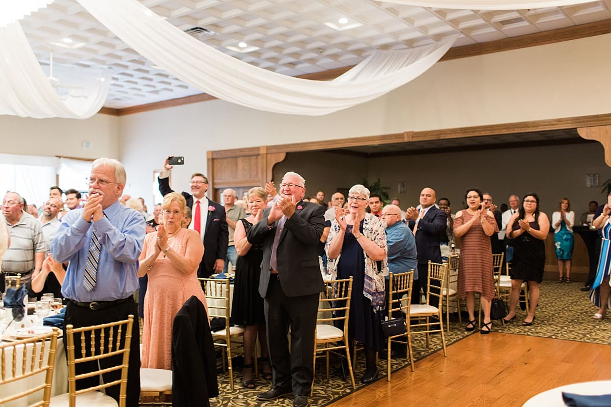 Arielle Peters Photography | Wedding guests cheering at reception at the Banquets at The Croatian Center in Merrillville, Indiana.
