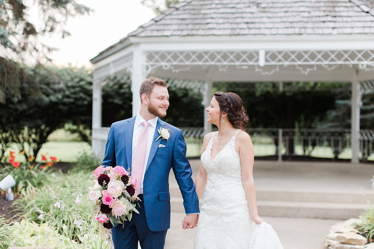 Arielle Peters Photography | Bride and groom walking outside on wedding day at the Banquets at The Croatian Center in Merrillville, Indiana.