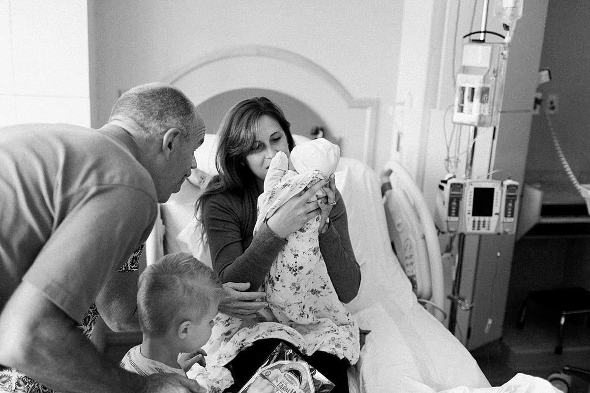 Arielle Peters Photography | Family meeting a newborn baby girl in the hospital.