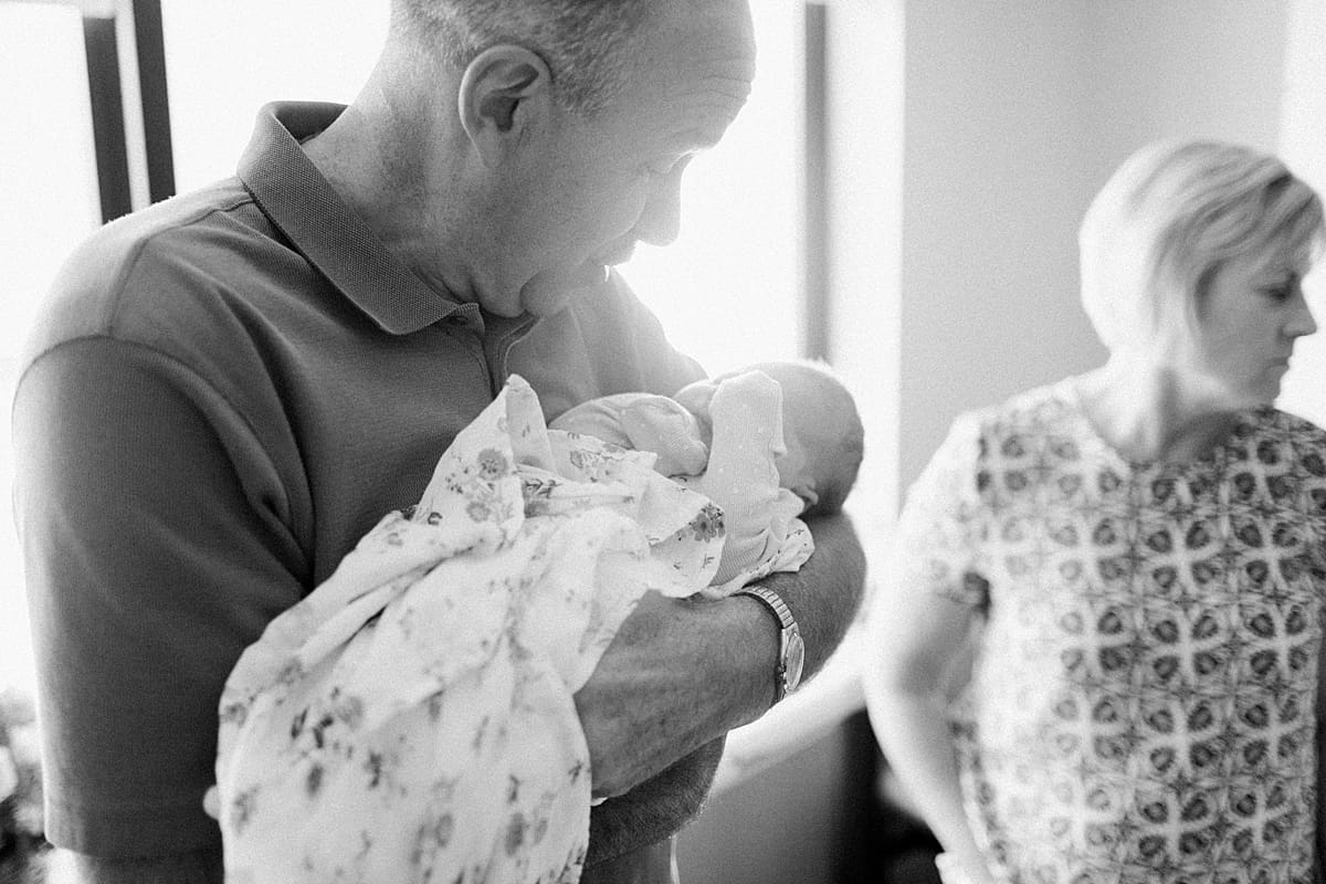 Arielle Peters Photography | Grandpa holding his newborn granddaughter.