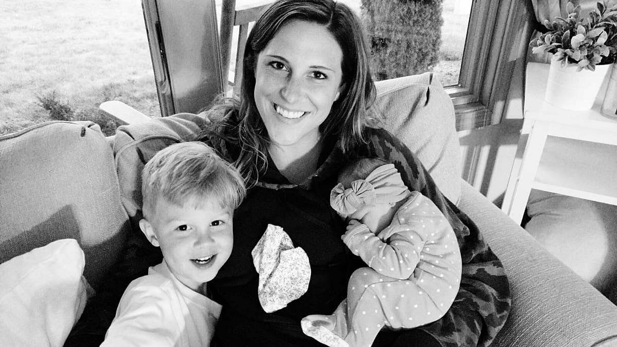 Arielle Peters Photography | Mom smiling with son and newborn baby girl.