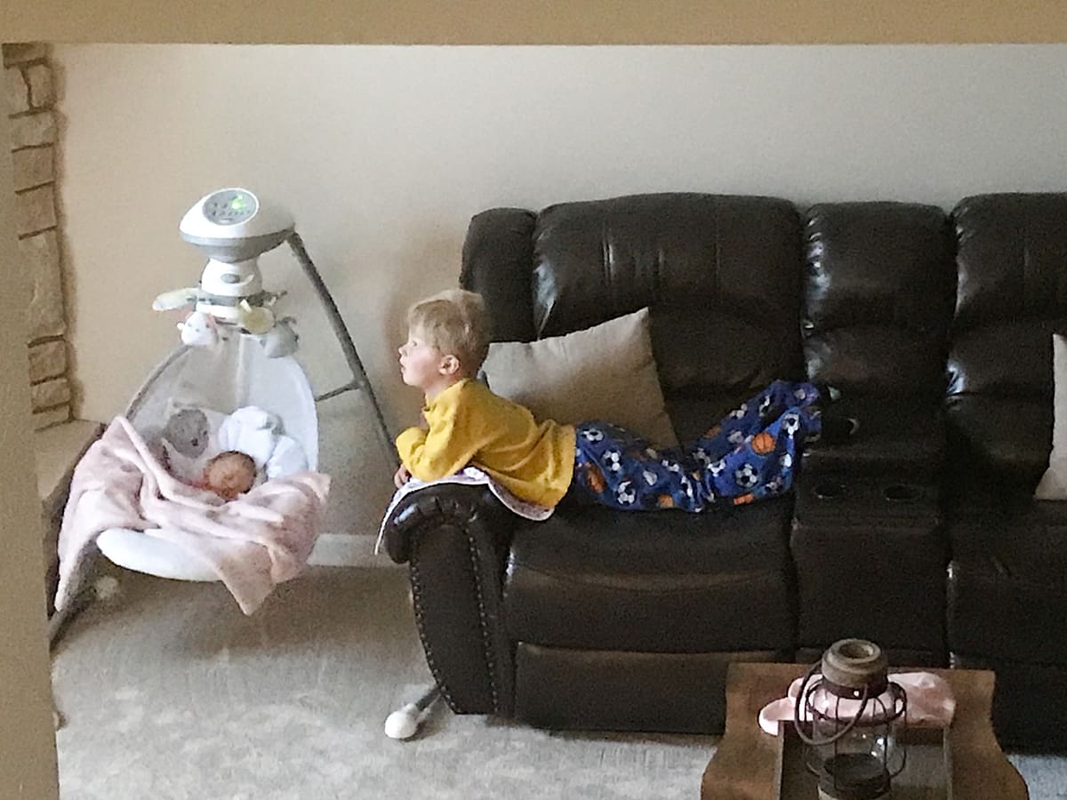 Arielle Peters Photography | Big brother watching over his newborn baby girl.