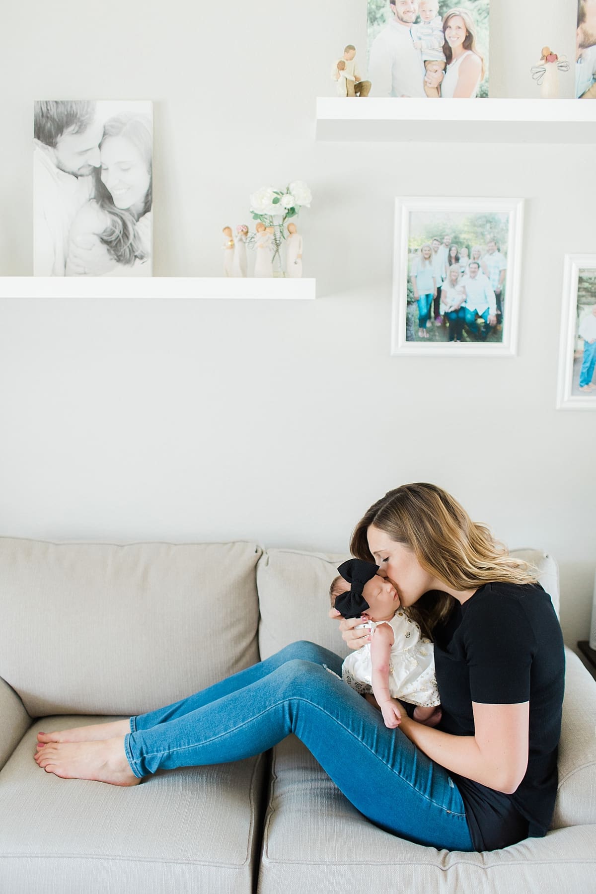 Arielle Peters Photography | Mom kissing newborn baby in one month photos. 