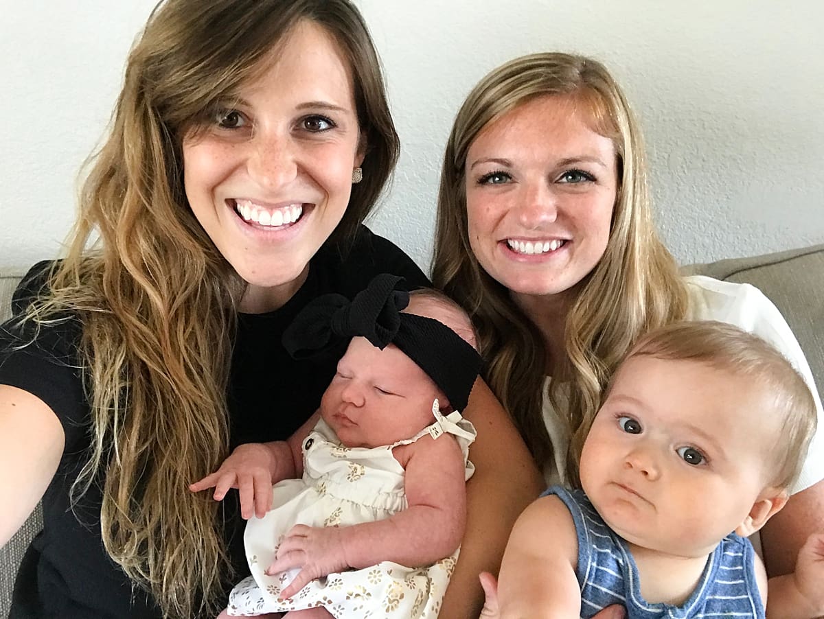 Arielle Peters Photography | Friends holding their newborn babies together.