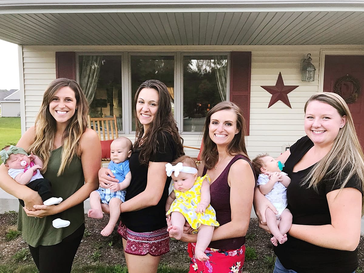 Arielle Peters Photography | Four new moms holding their babies together. 