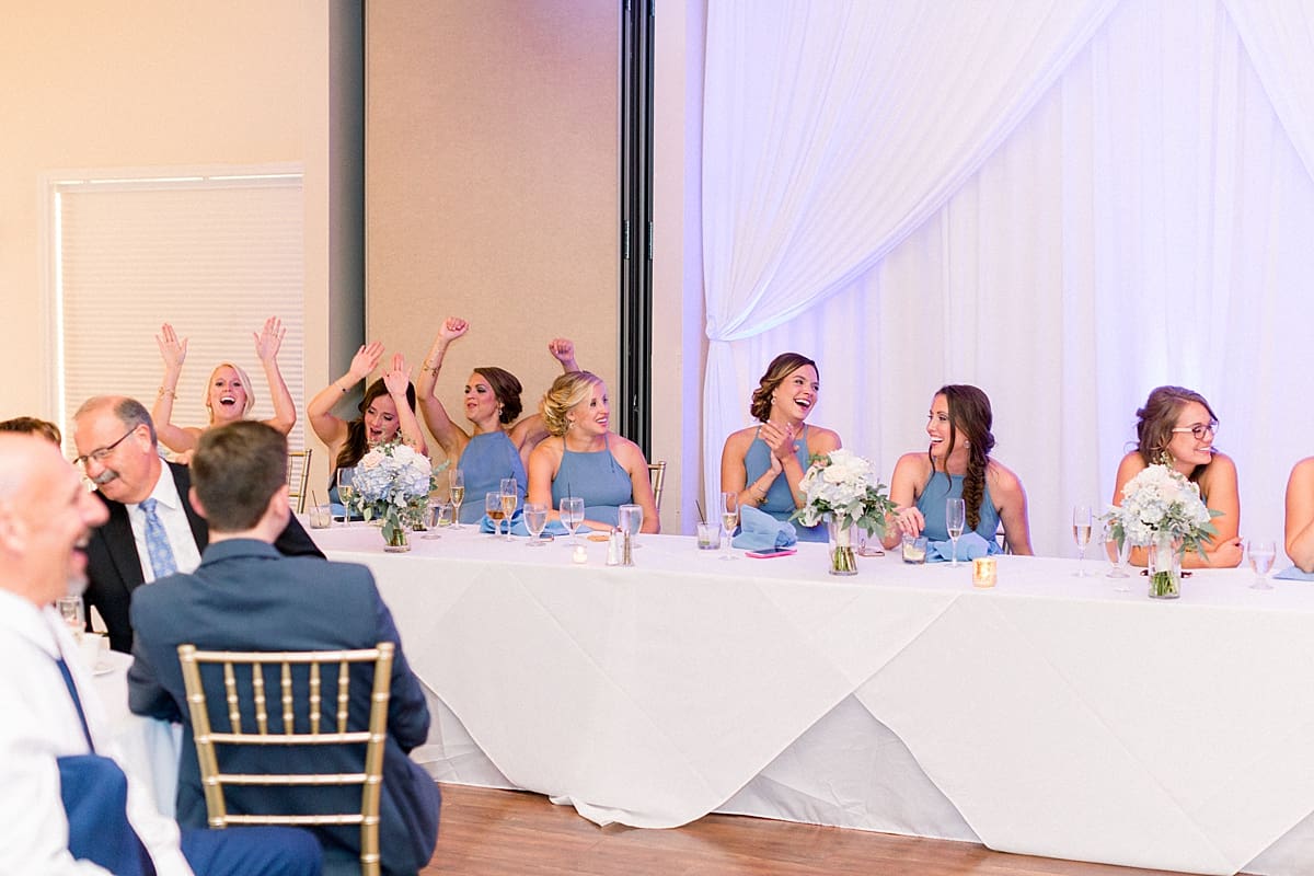 Arielle Peters Photography | Bridesmaids laughing at wedding reception at The Blue Heron at Blackthorn in South Bend, Indiana on wedding day.