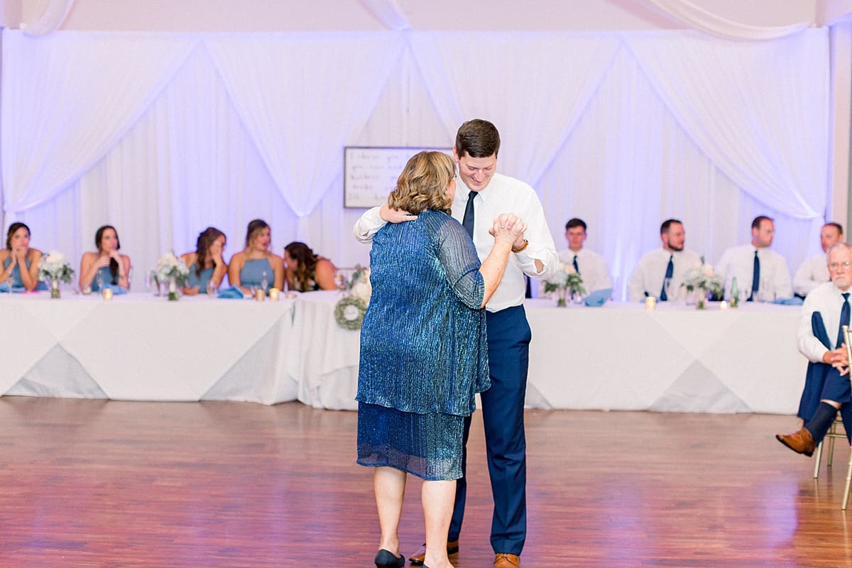 Arielle Peters Photography | Mother of the groom and groom dancing at the wedding reception at The Blue Heron at Blackthorn in South Bend, Indiana on wedding day.