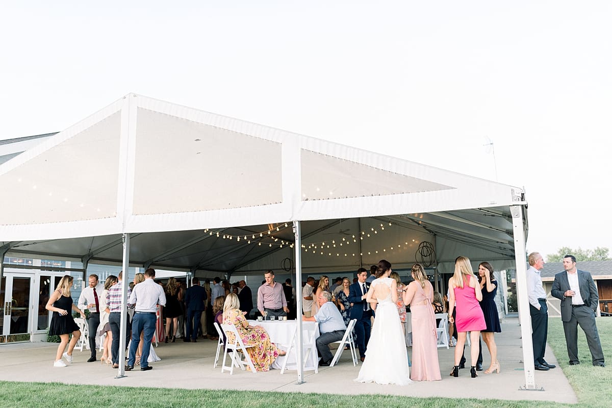 Arielle Peters Photography | Wedding guests outside at wedding reception at The Blue Heron at Blackthorn in South Bend, Indiana on wedding day.