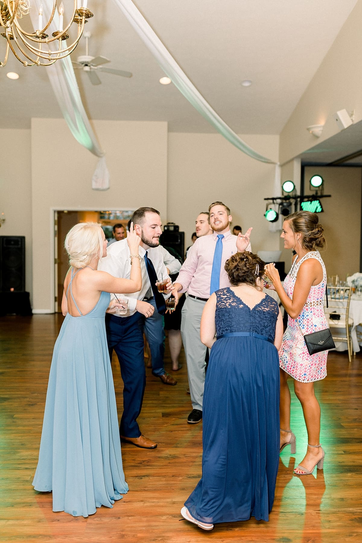 Arielle Peters Photography | Wedding guests dancing at wedding reception at The Blue Heron at Blackthorn in South Bend, Indiana on wedding day.