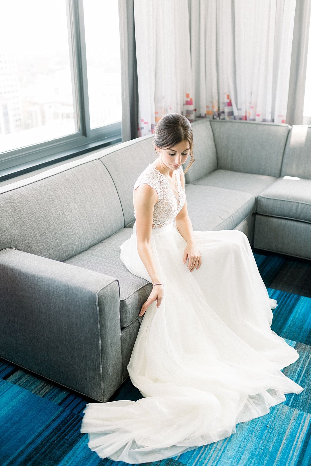 Arielle Peters Photography | Bride sitting in her gown at The Blue Heron at Blackthorn in South Bend, Indiana on wedding day.