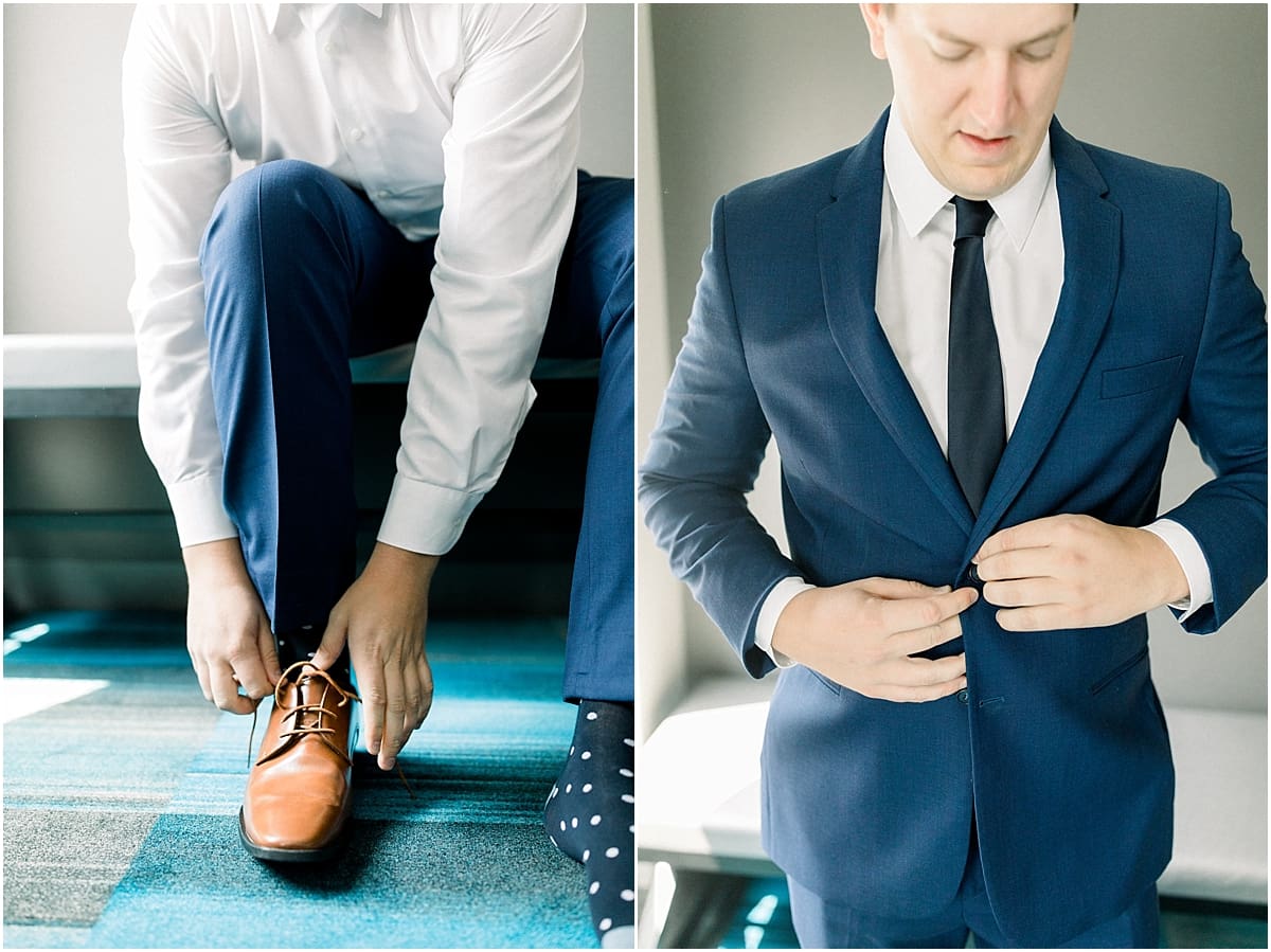 Arielle Peters Photography | Groom putting on jacket getting ready for wedding at The Blue Heron at Blackthorn in South Bend, Indiana on wedding day.