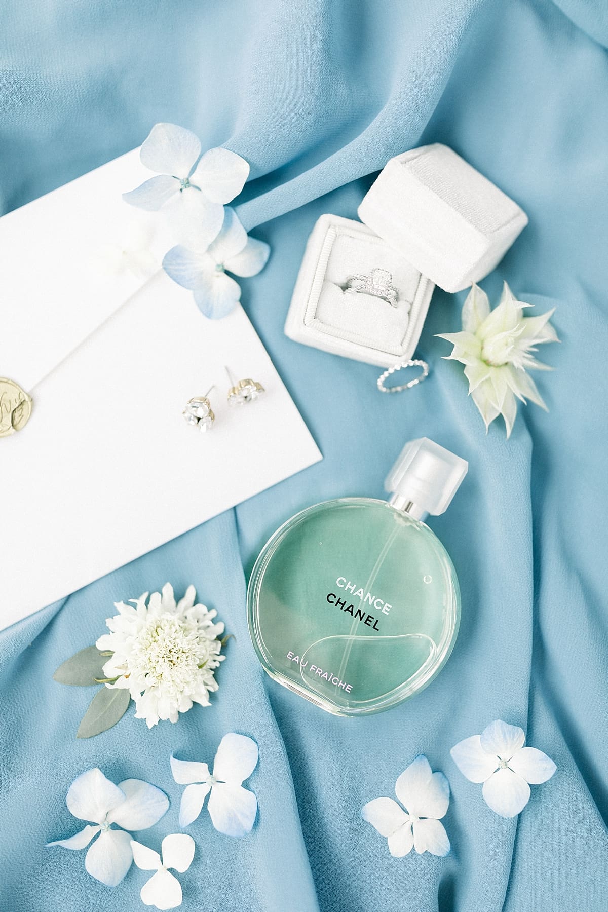 Arielle Peters Photography | Wedding rings and perfume at The Blue Heron at Blackthorn in South Bend, Indiana on wedding day.