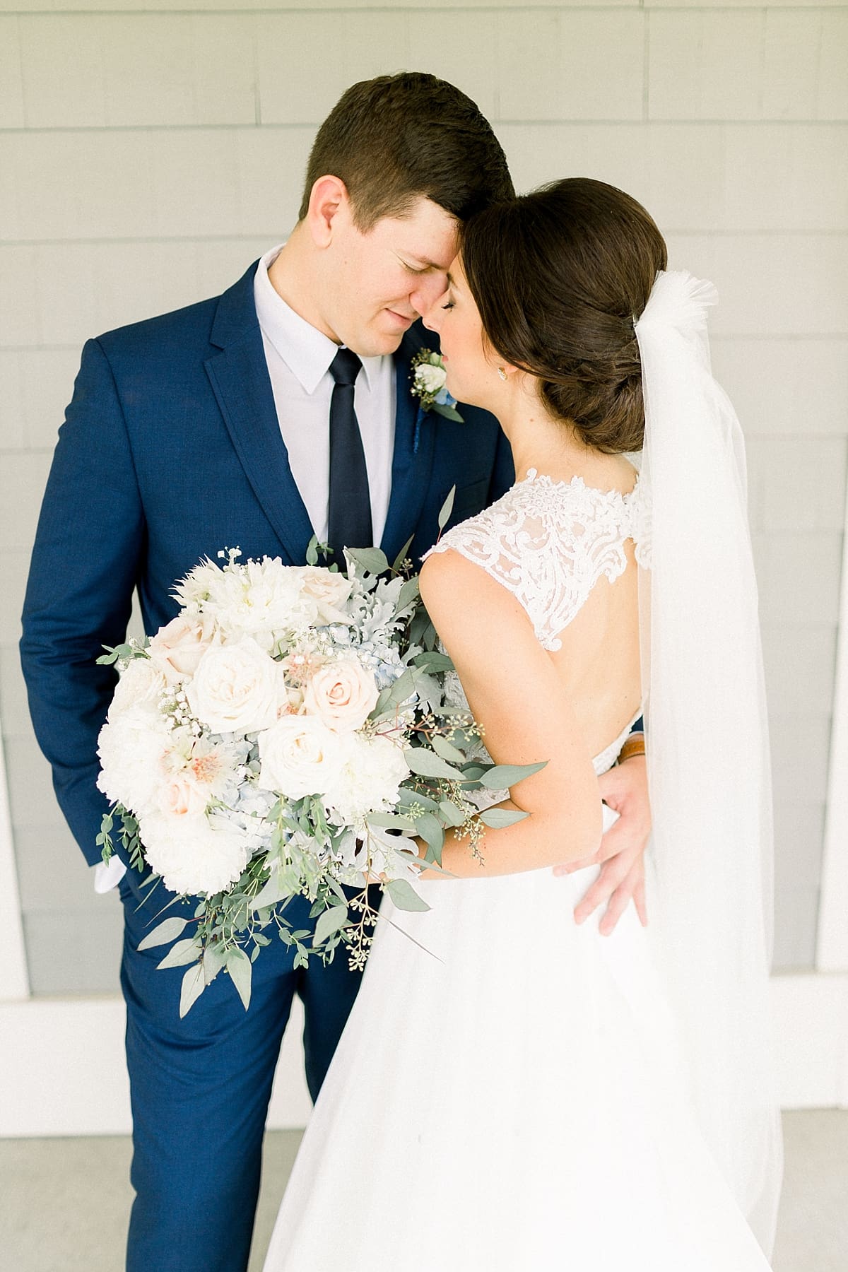 Arielle Peters Photography | Bride and groom holding each other at The Blue Heron at Blackthorn in South Bend, Indiana on wedding day.