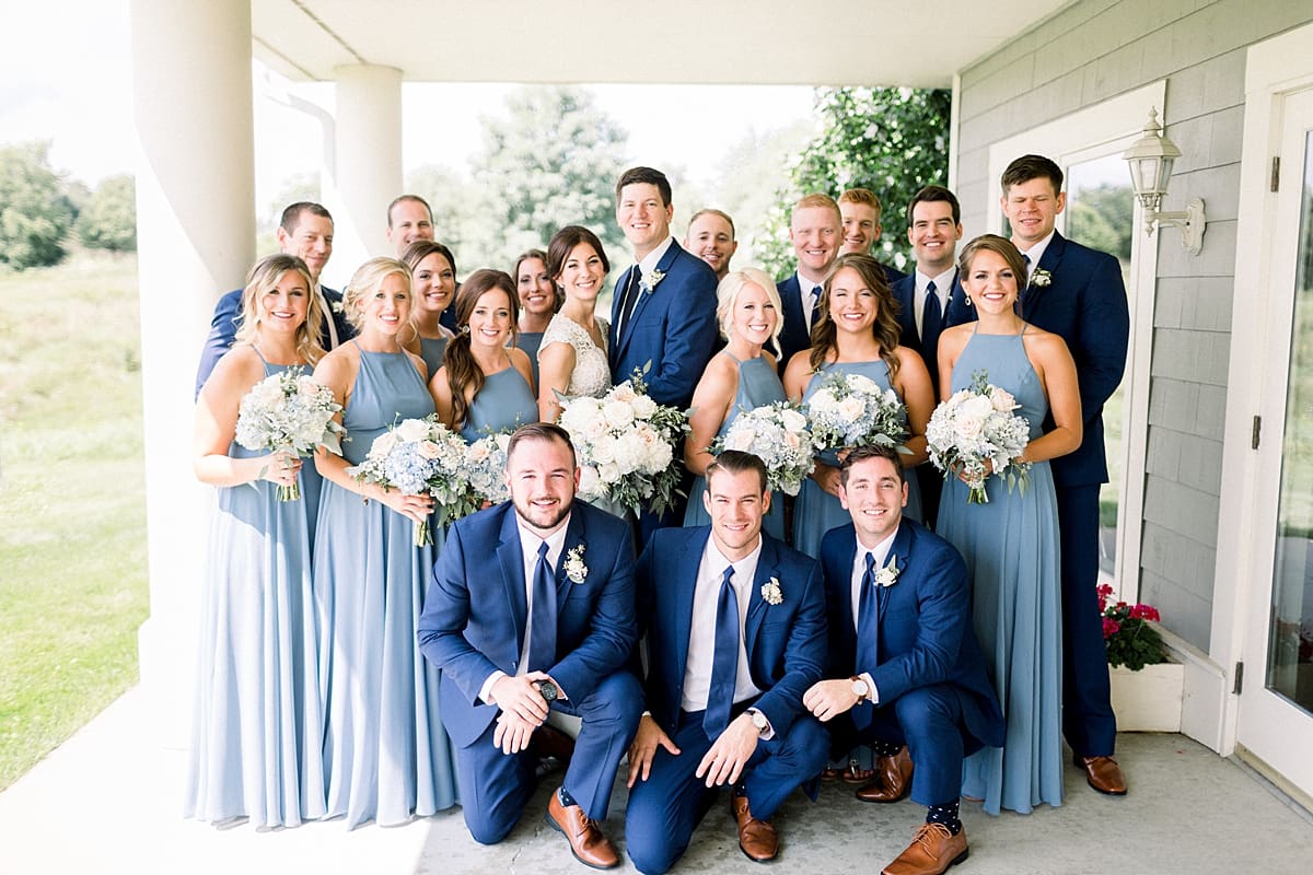 Arielle Peters Photography | Wedding party smiling outside at The Blue Heron at Blackthorn in South Bend, Indiana on wedding day.