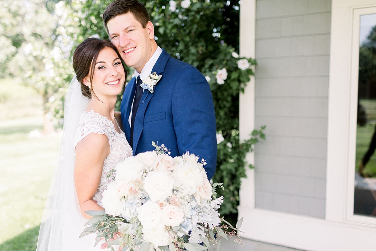 Arielle Peters Photography | Bride and groom smiling outside at The Blue Heron at Blackthorn in South Bend, Indiana on wedding day.