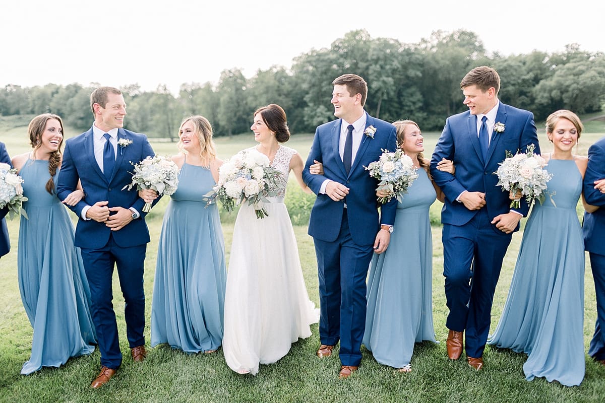 Arielle Peters Photography | Wedding party smiling outside at The Blue Heron at Blackthorn in South Bend, Indiana on wedding day.