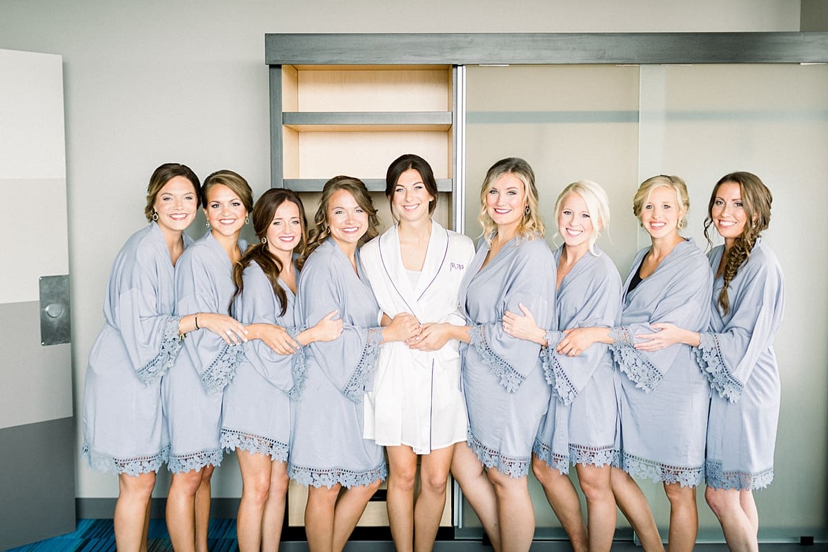 Arielle Peters Photography | Bride and bridesmaids in robes getting ready on wedding day at The Blue Heron at Blackthorn in South Bend, Indiana on wedding day.