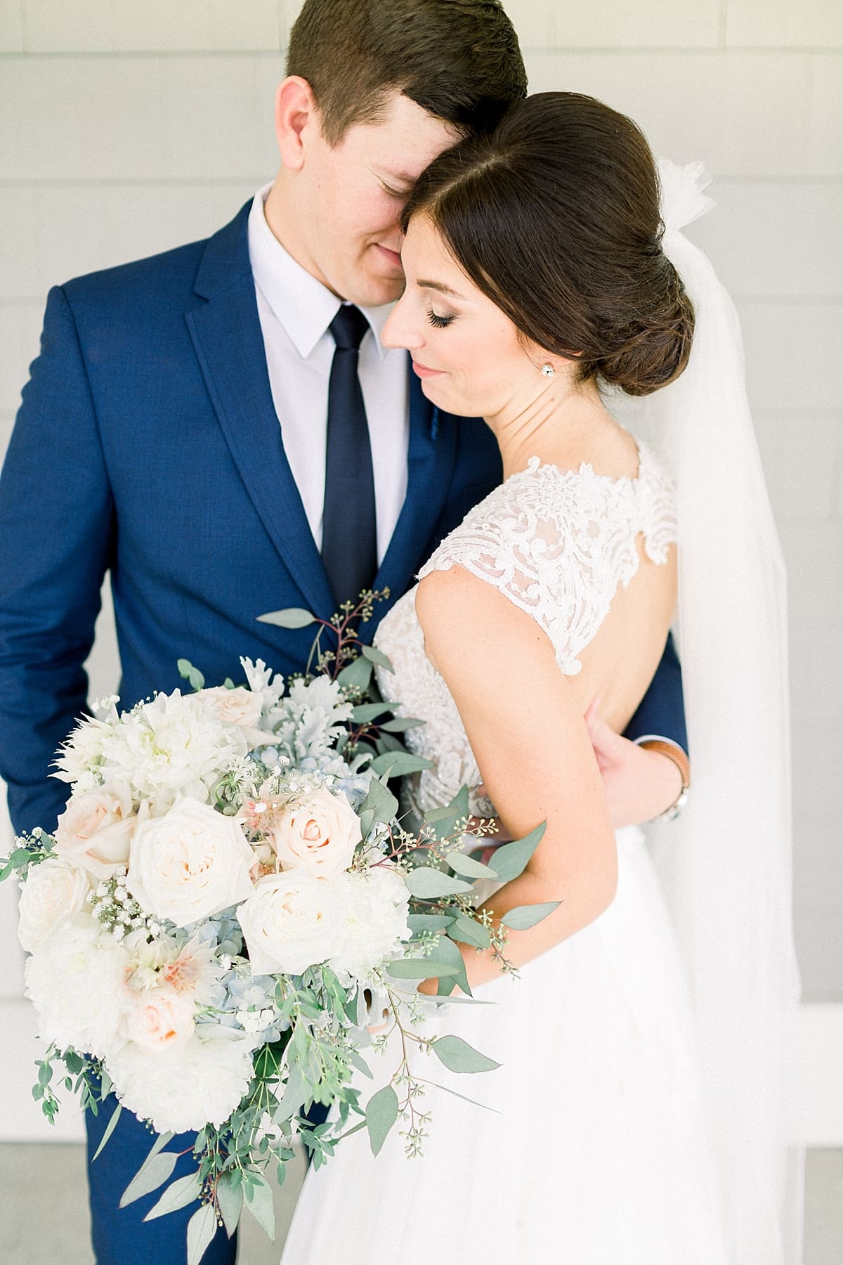 Arielle Peters Photography | Bride and groom holding each other at The Blue Heron at Blackthorn in South Bend, Indiana on wedding day.