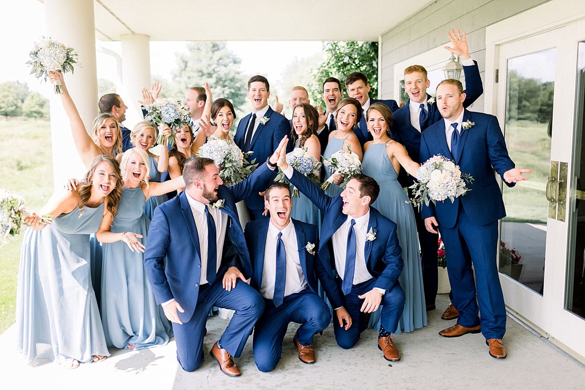 Arielle Peters Photography | Wedding party cheering at The Blue Heron at Blackthorn in South Bend, Indiana on wedding day.