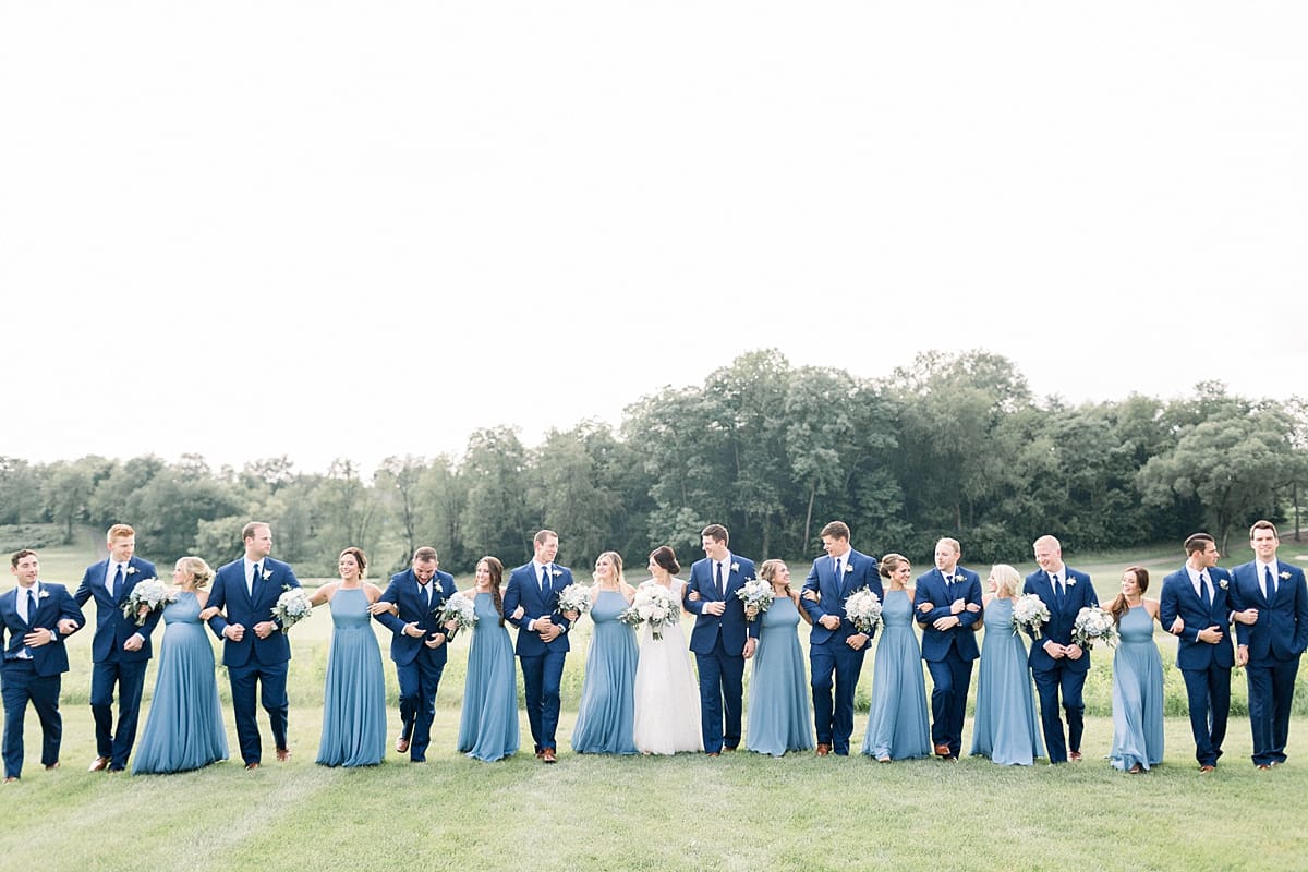 Arielle Peters Photography | Wedding party walking outside at The Blue Heron at Blackthorn in South Bend, Indiana on wedding day.