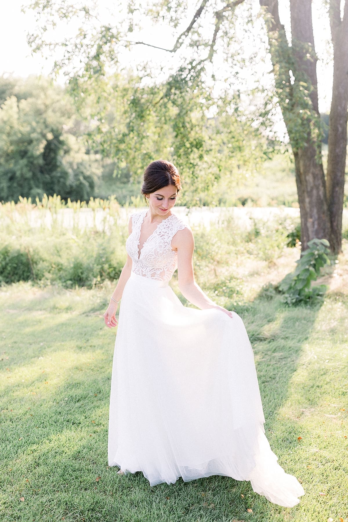 Arielle Peters Photography | Bride dancing in her gown outside at The Blue Heron at Blackthorn in South Bend, Indiana on wedding day.