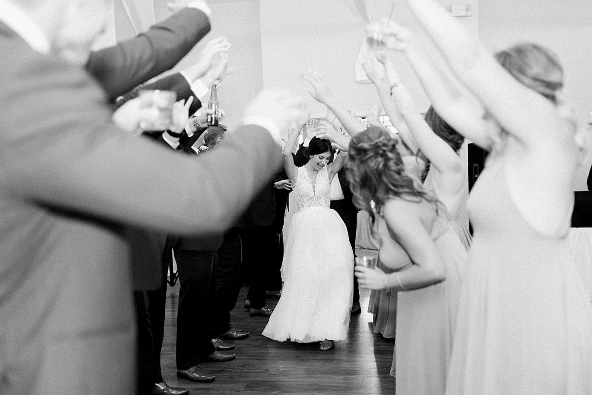 Arielle Peters Photography | Bride and groom entering the wedding reception at The Blue Heron at Blackthorn in South Bend, Indiana on wedding day.
