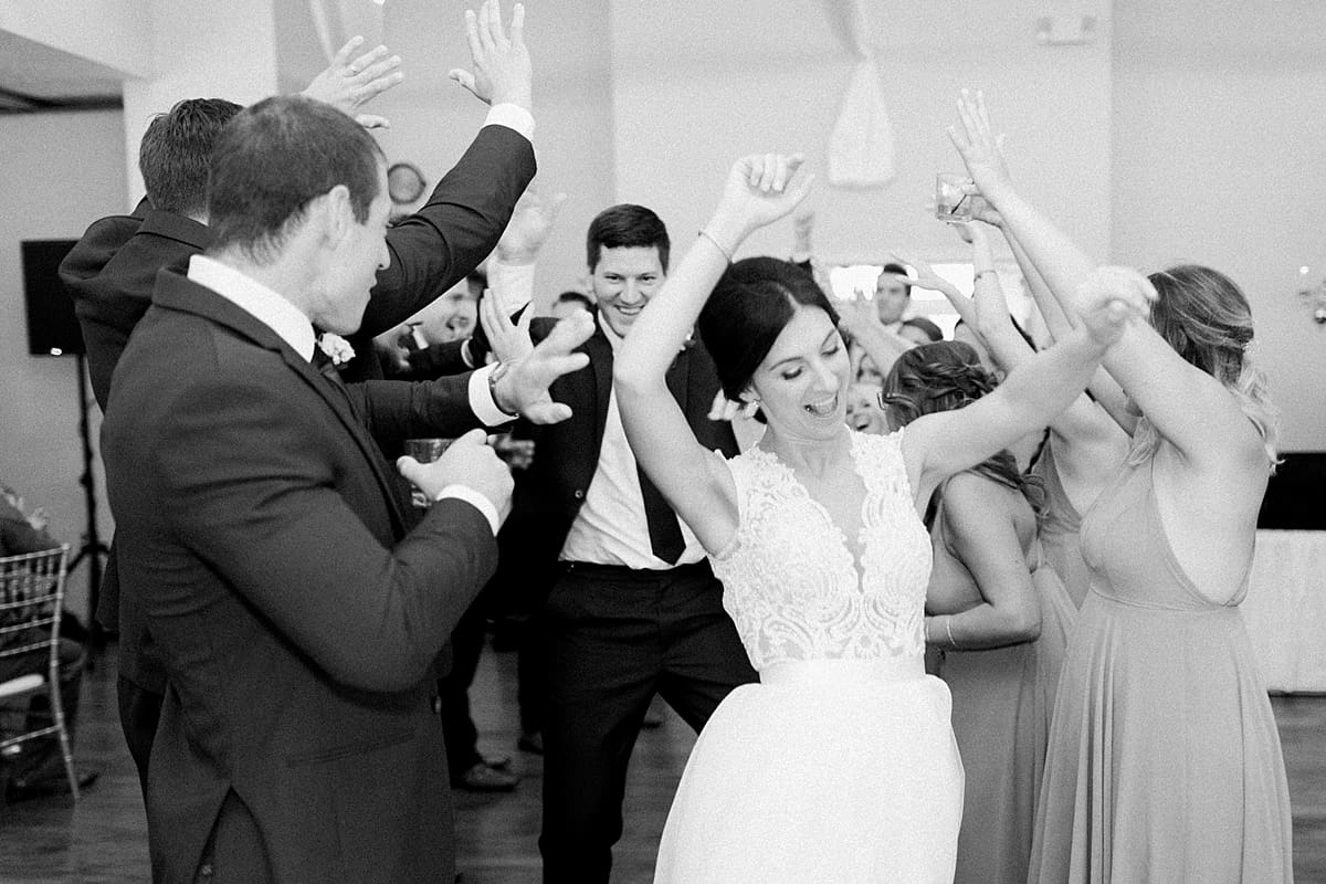 Arielle Peters Photography | Bride and groom entering the wedding reception at The Blue Heron at Blackthorn in South Bend, Indiana on wedding day.