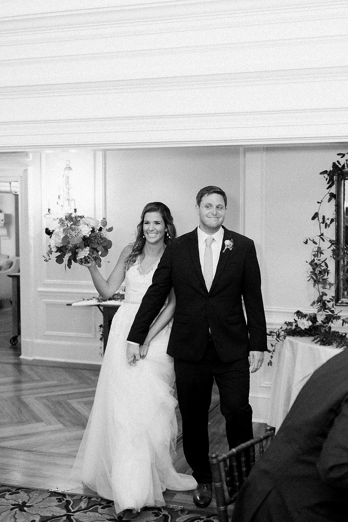 Arielle Peters Photography | Bride and groom entering wedding reception at Sycamore Hills Golf Club in Fort Wayne, Indiana on wedding day.