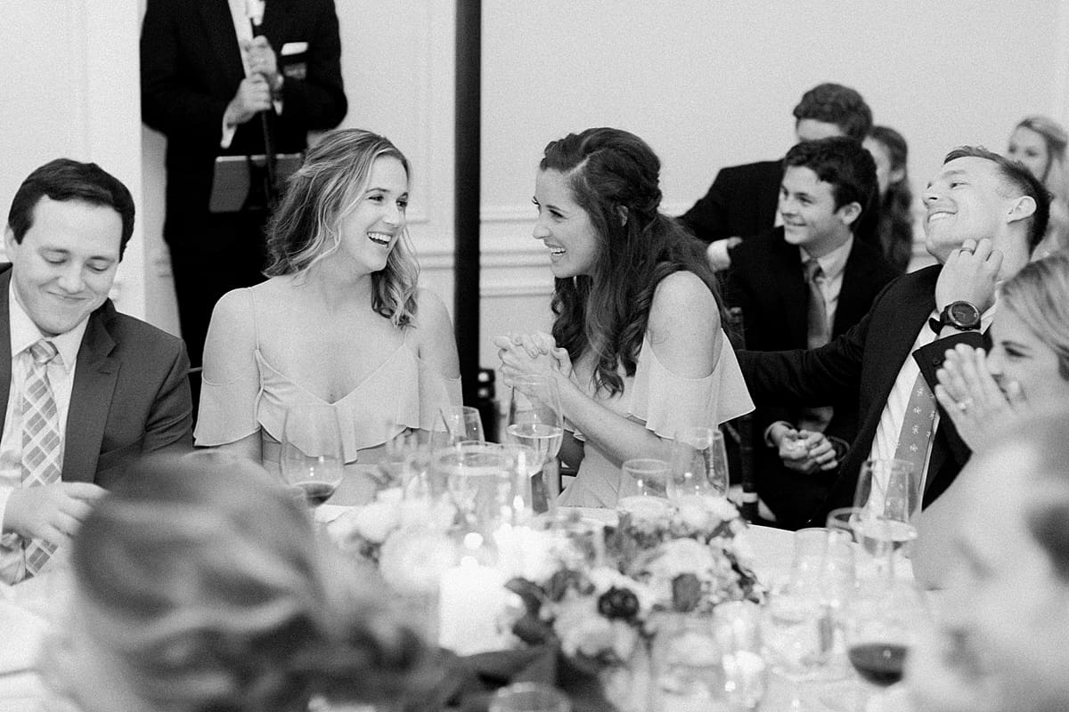 Arielle Peters Photography | Wedding guests laughing at wedding reception at Sycamore Hills Golf Club in Fort Wayne, Indiana on wedding day.