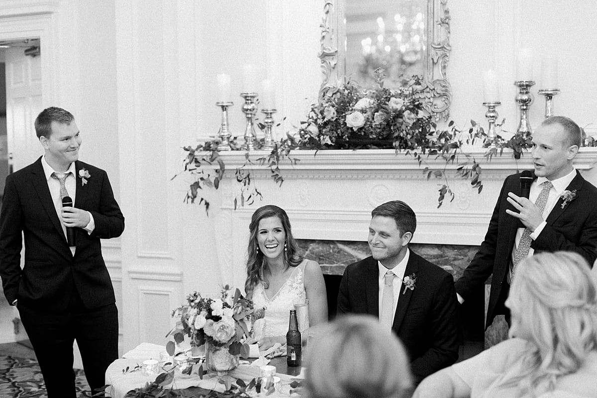 Arielle Peters Photography | Bride and groom laughing at wedding reception at Sycamore Hills Golf Club in Fort Wayne, Indiana on wedding day.