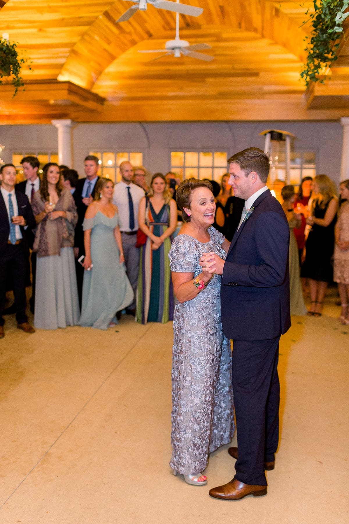 Arielle Peters Photography | Mother of the groom and groom sharing a dance at wedding reception at Sycamore Hills Golf Club in Fort Wayne, Indiana on wedding day.