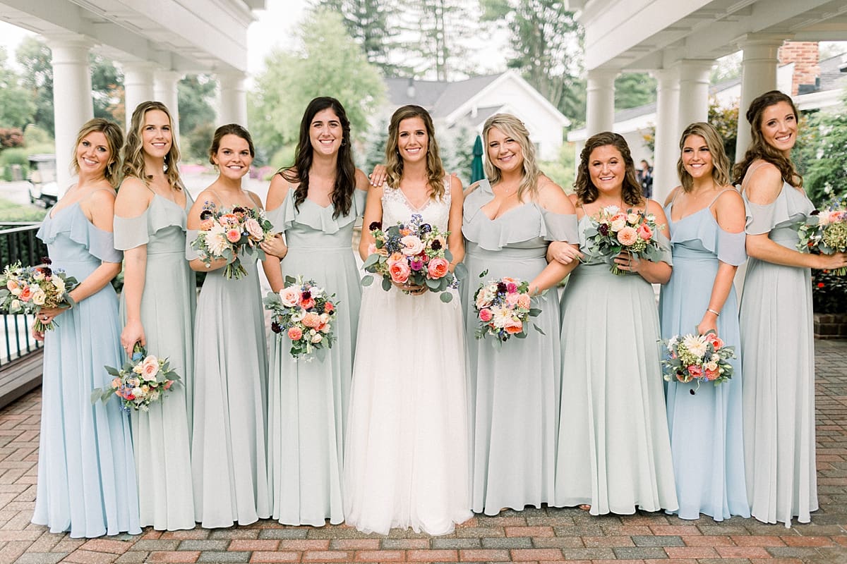 Arielle Peters Photography | Bride and bridesmaids smiling on wedding day at Sycamore Hills Golf Club in Fort Wayne, Indiana.