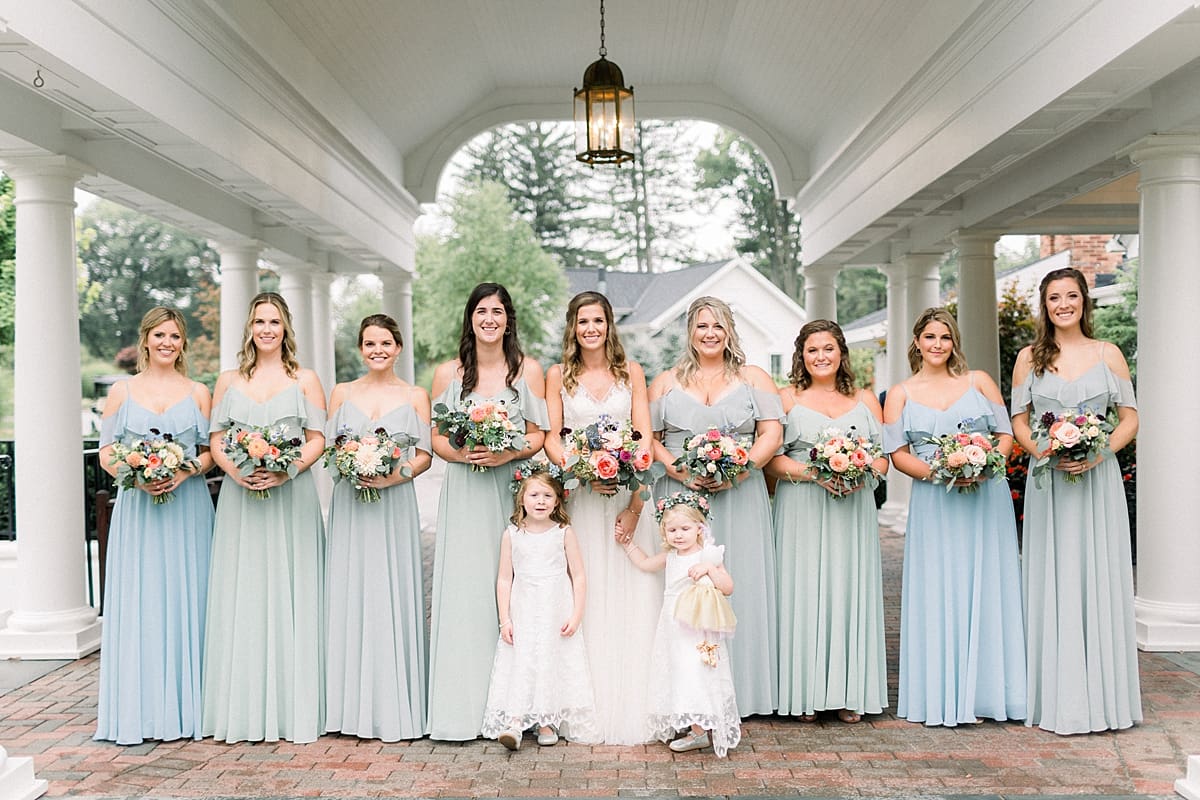 Arielle Peters Photography | Bride and bridesmaids smiling outside on wedding day at Sycamore Hills Golf Club in Fort Wayne, Indiana.