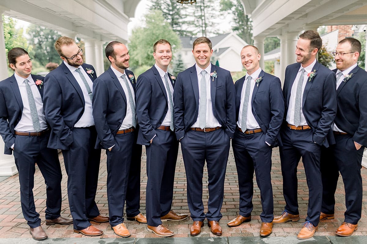 Arielle Peters Photography | Groom and groomsmen smiling outside on wedding day at Sycamore Hills Golf Club in Fort Wayne, Indiana.