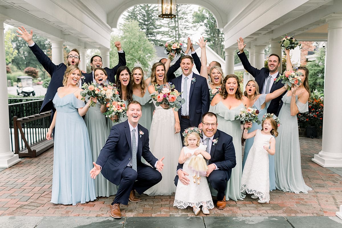Arielle Peters Photography | Wedding party cheering outside on wedding day at Sycamore Hills Golf Club in Fort Wayne, Indiana.
