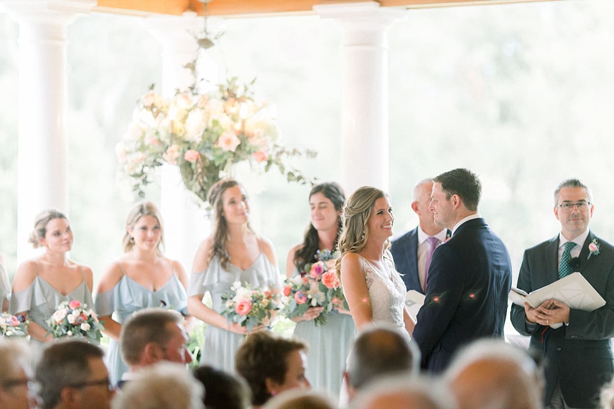 Arielle Peters Photography | Bride and groom smiling at the alter at Sycamore Hills Golf Club in Fort Wayne, Indiana on wedding day.