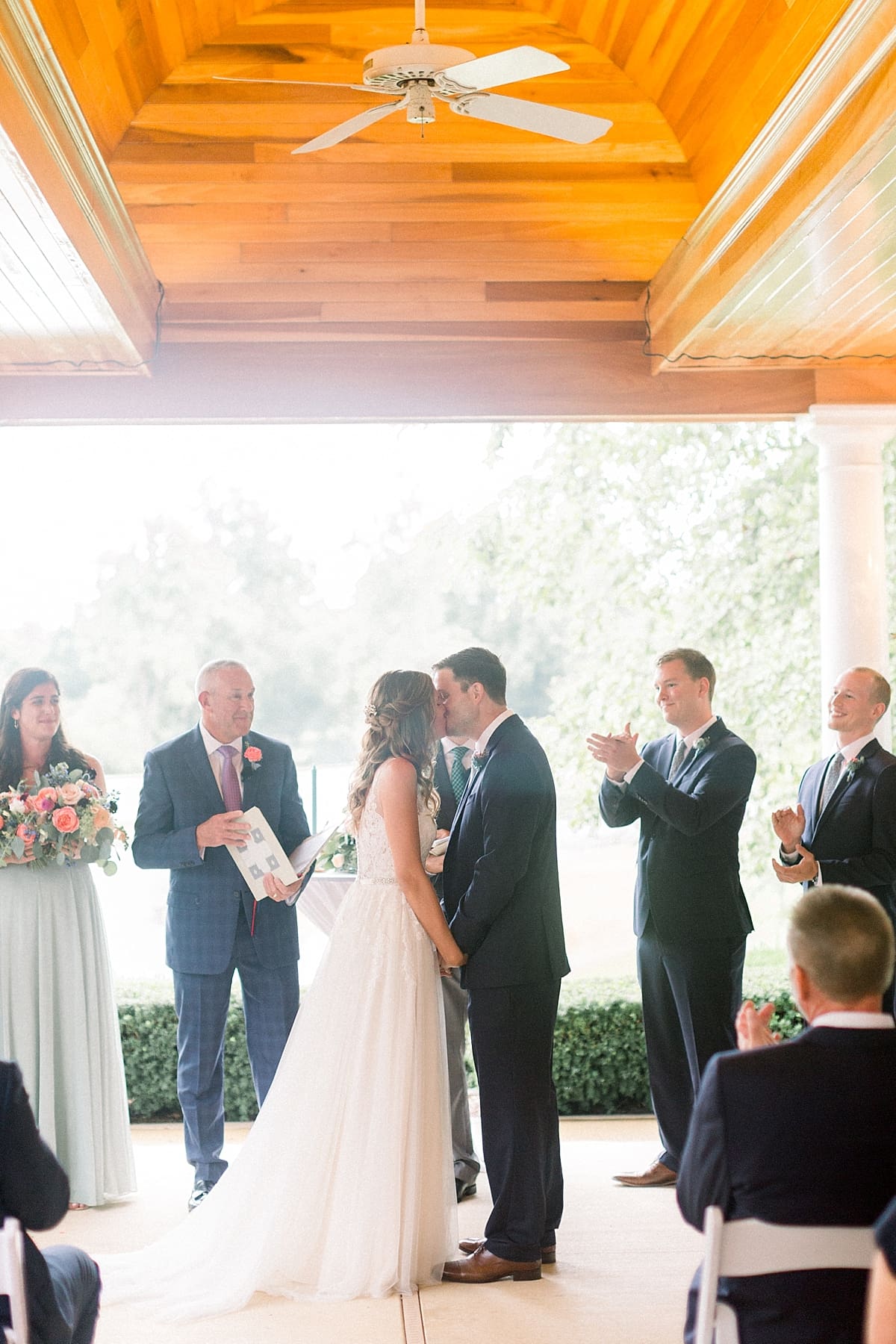 Arielle Peters Photography | Bride and groom kissing at the alter at Sycamore Hills Golf Club in Fort Wayne, Indiana on wedding day.