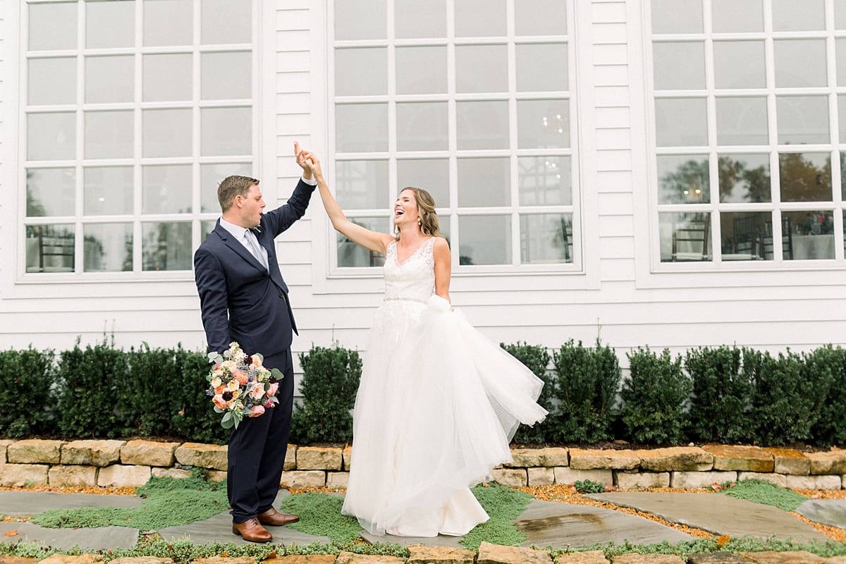 Arielle Peters Photography | Bride and groom dancing outside in the rain at Sycamore Hills Golf Club in Fort Wayne, Indiana on wedding day.