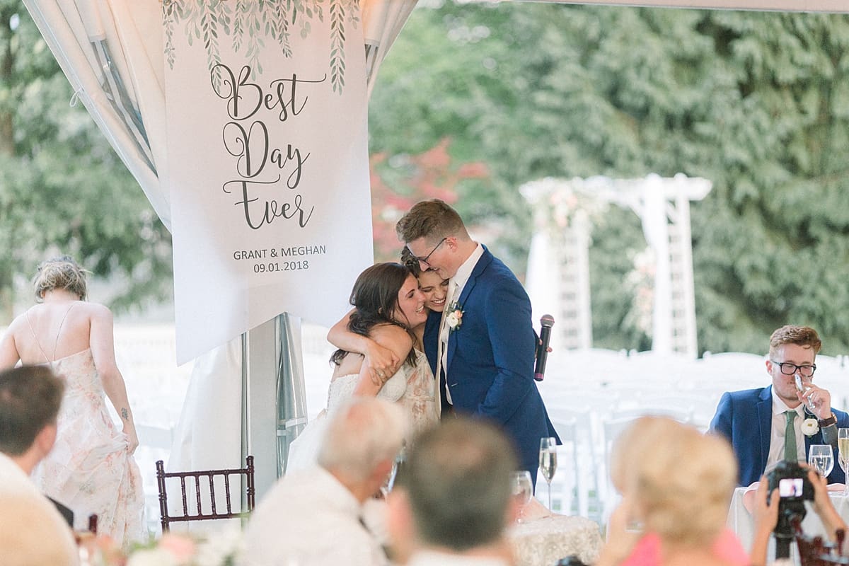 Arielle Peters Photography | Bride and groom hugging the maid of honor at the wedding reception at The Bridgewater Club in Carmel, Indiana on wedding day.